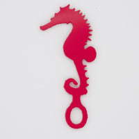 Dark pink seahorse shaped Swim Loops goggle tag to label swim goggles