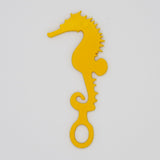Yellow seahorse shaped Swim Loops goggle tag to label swim goggles