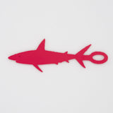 Dark pink shark shaped Swim Loops goggle tag to label swim goggles