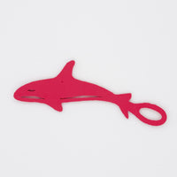 Dark pink orca shaped Swim Loops goggle tag to label swim goggles
