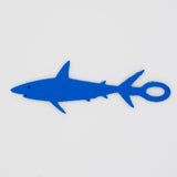 Blue shark shaped Swim Loops goggle tag to label swim goggles