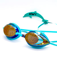 Dolphin shaped goggle tag to identify your goggles when you leave them on the pool deck. Get your Swim Loops goggle tags at www.swimloops.com.