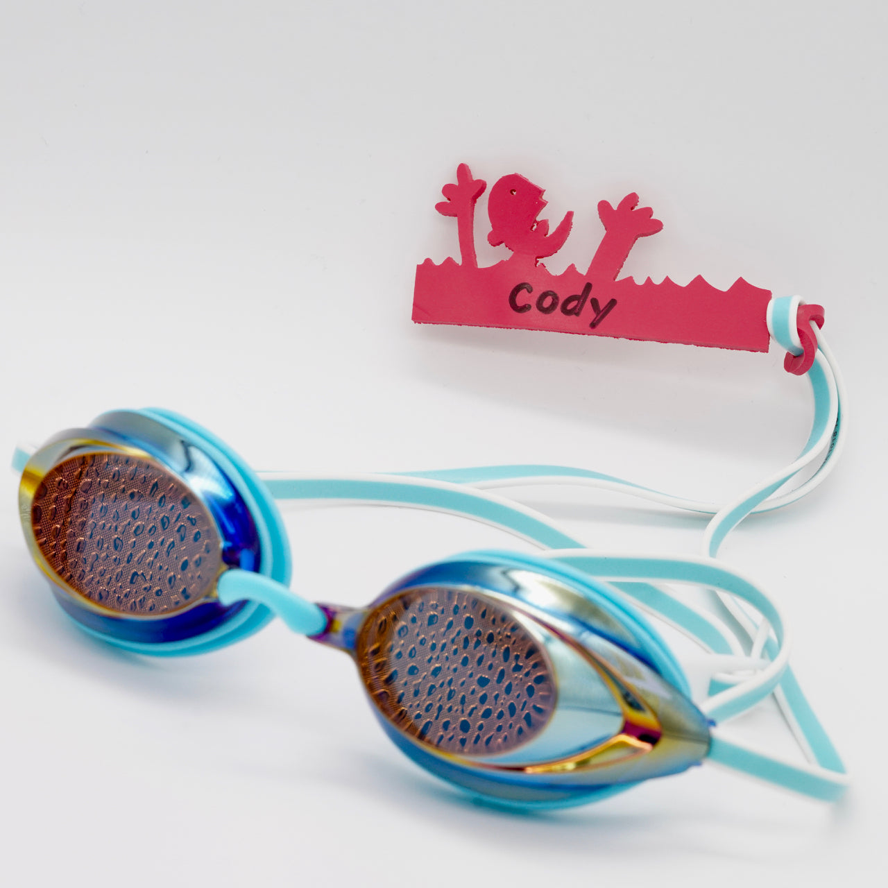 Dark pink Drowning Daryl shaped Swim Loops goggle tag for labeling swim goggles attached to swim goggles