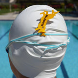 Yellow unicorn shaped Swim Loops goggle tag to label swim goggles attached to swim goggles on a swimmers head