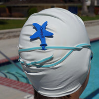 Blue starfish shaped Swim Loops goggle tag to label swim goggles attached to swim goggles on swimmers head